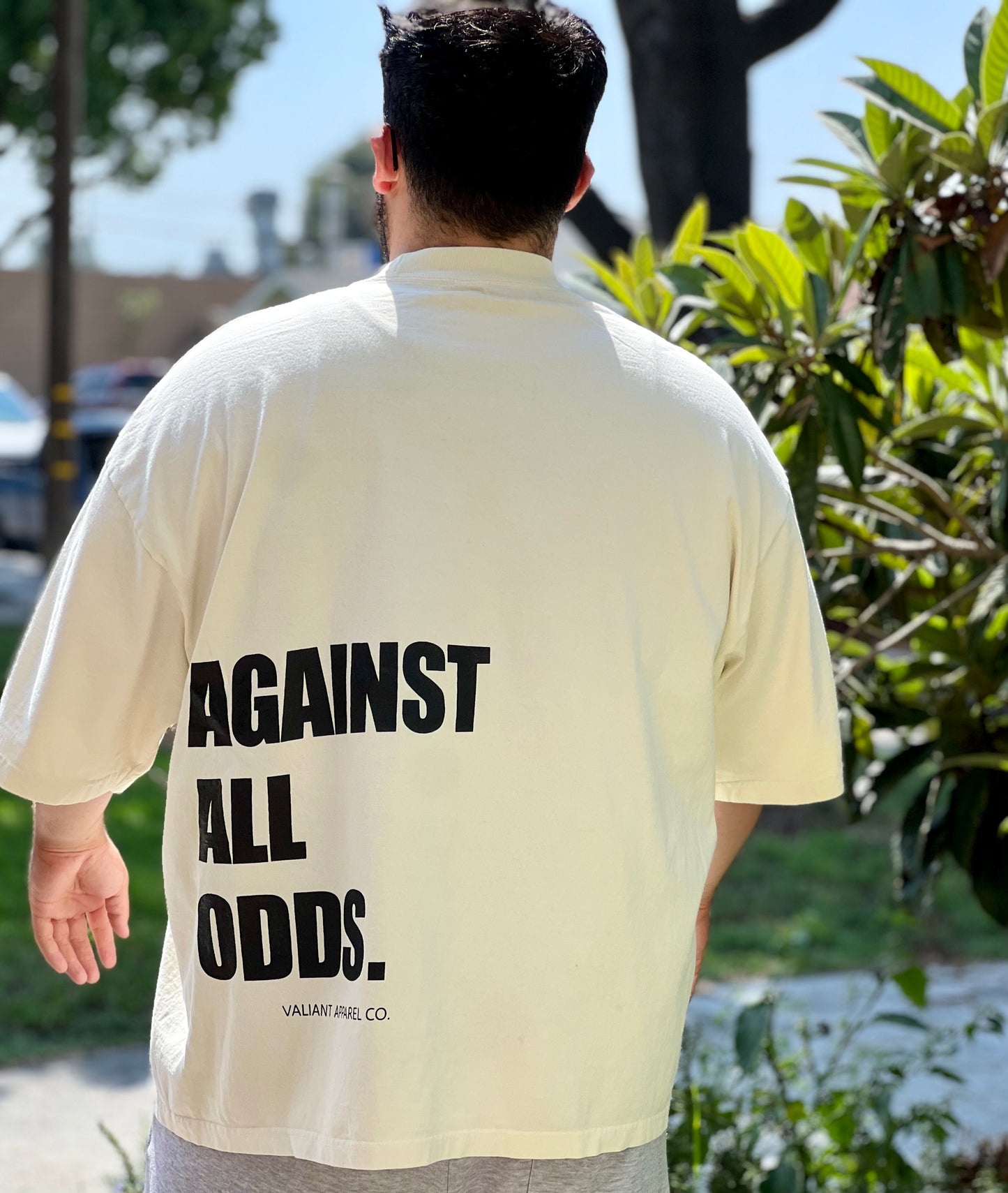 “AGAINST ALL ODDS” Drop Shoulder Tee