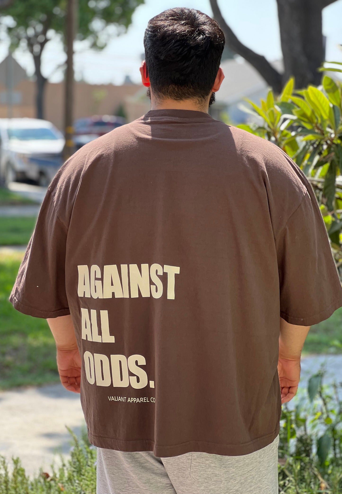 “AGAINST ALL ODDS” Drop Shoulder Tee