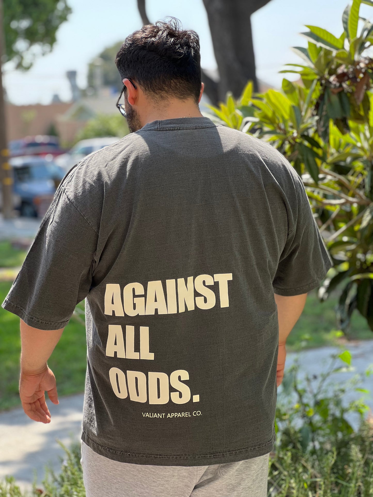 “AGAINST ALL ODDS” Drop Shoulder Tee