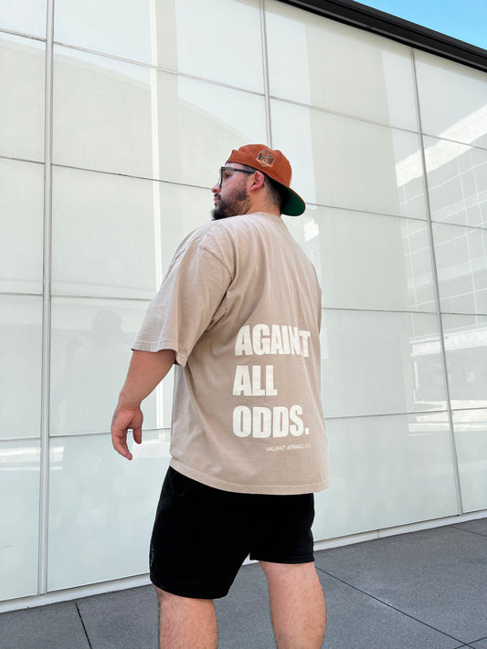 “AGAINST ALL ODDS” Drop Shoulder Tee