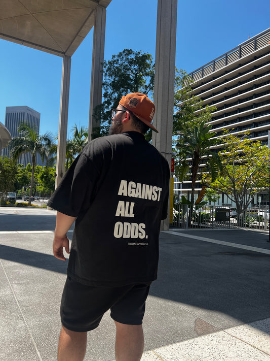 “AGAINST ALL ODDS” Drop Shoulder Tee